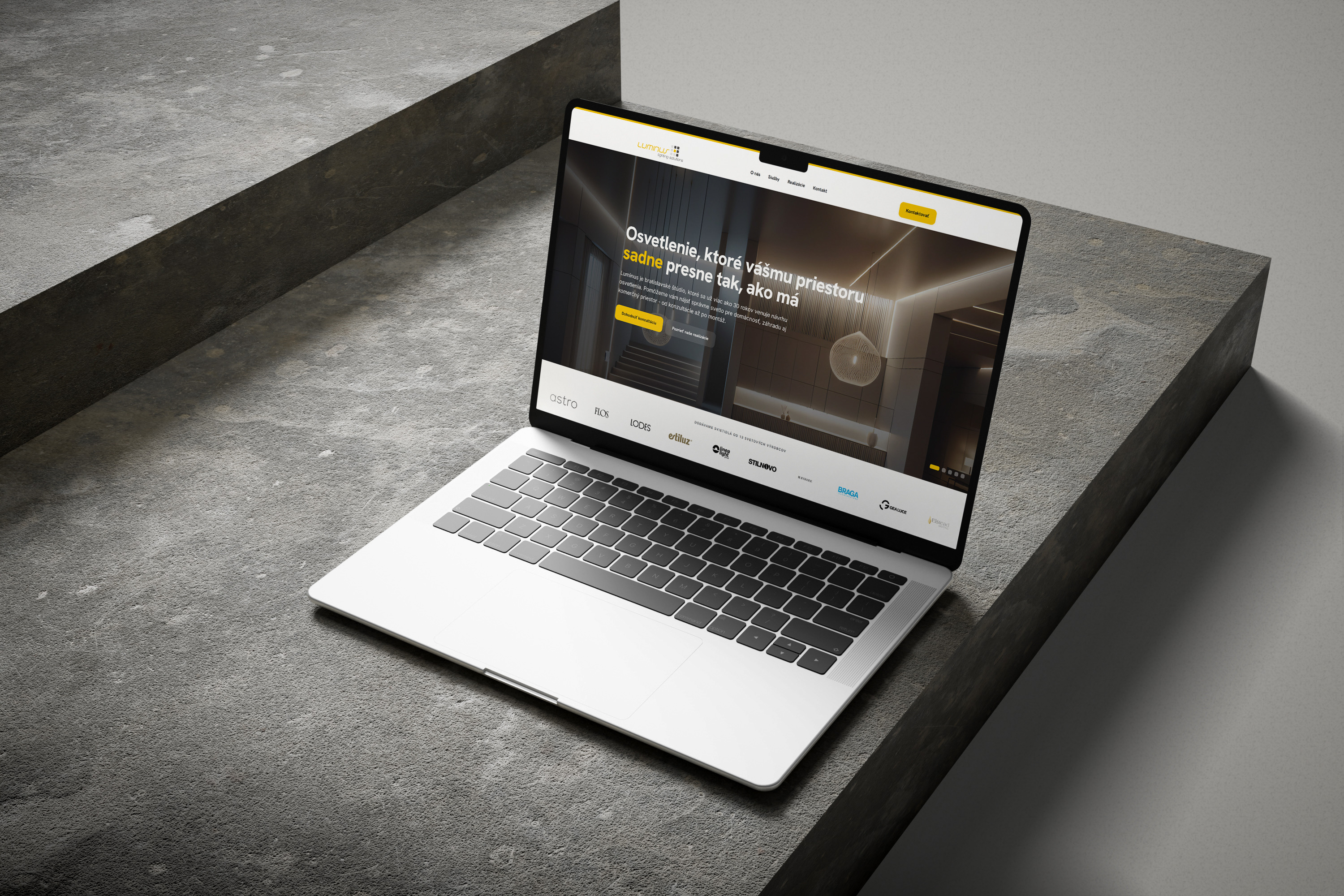Luminus - úvodná obrazovka webu na MacBooku